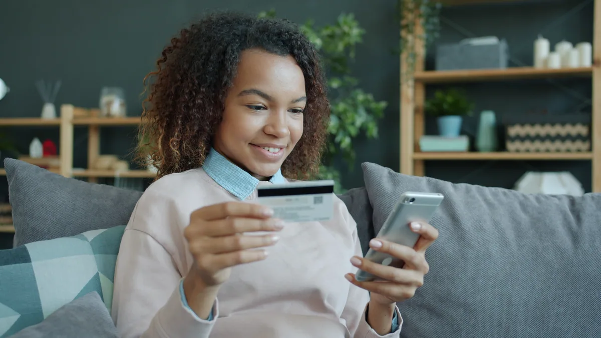 Woman using BrightWay credit card mobile app smartphone account management